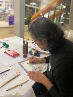 Zuheir Elia demonstrates Arabic calligraphy